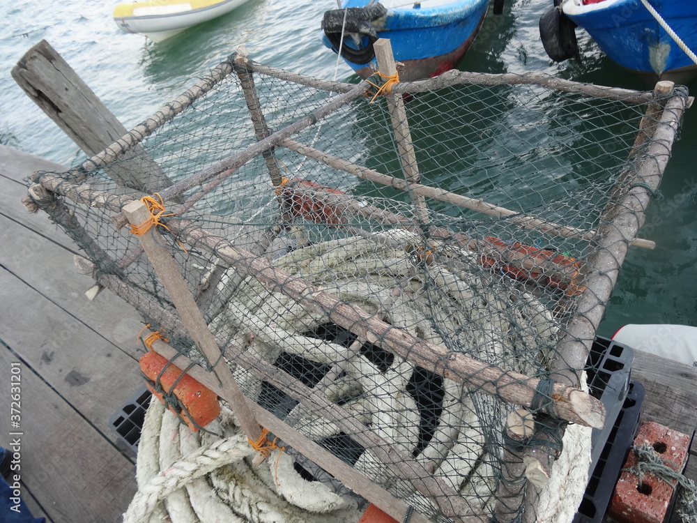 東南アジアの魚を獲るかご/Primitive fishing basket at pier Stock Photo