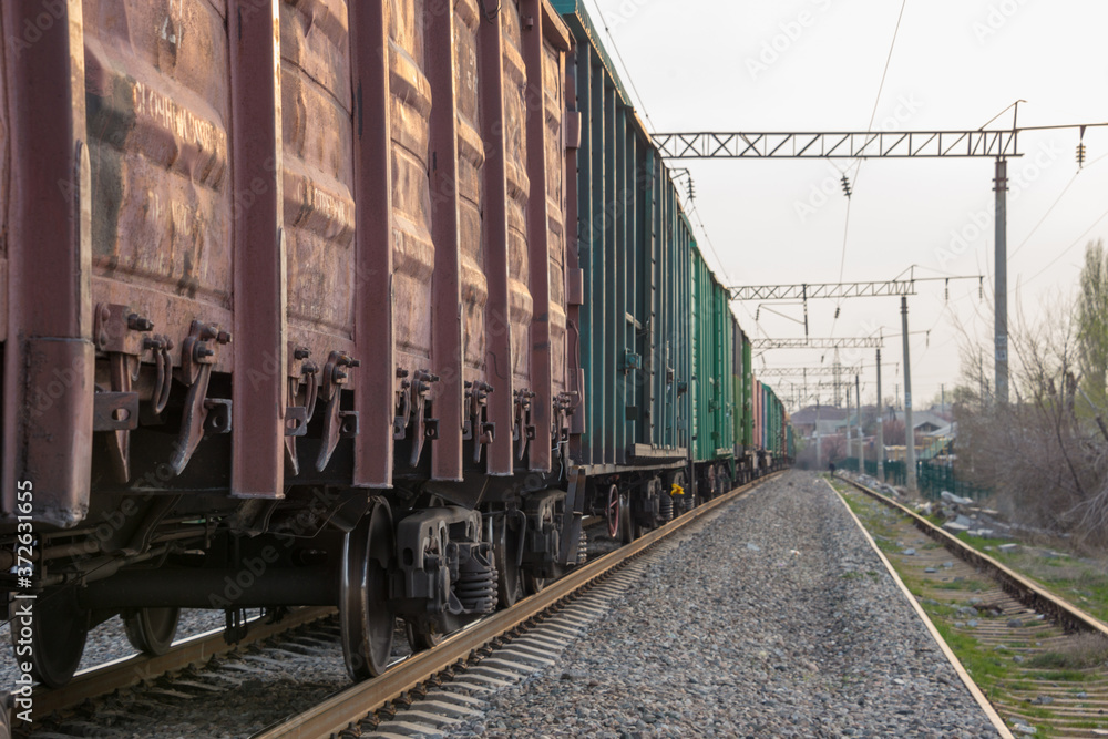 freight train moves during sunset.