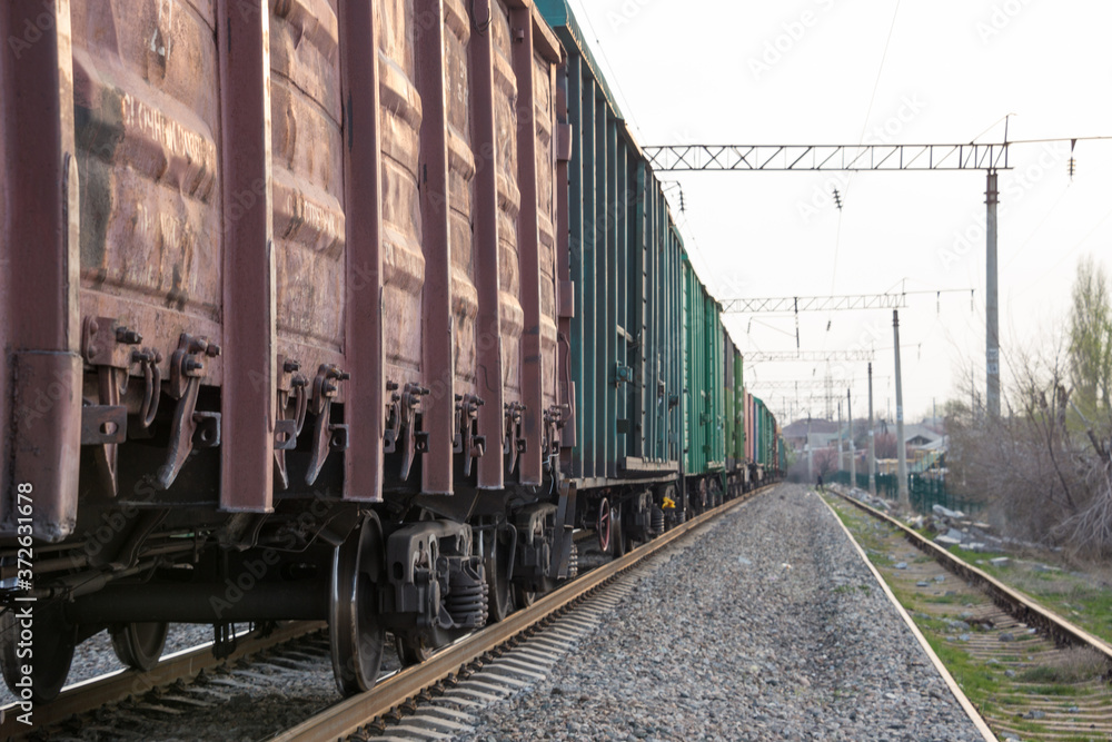 freight train moves during sunset.