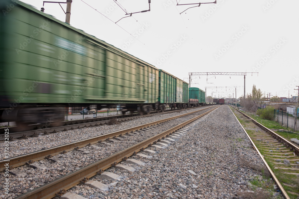 freight train moves fast during sunset.