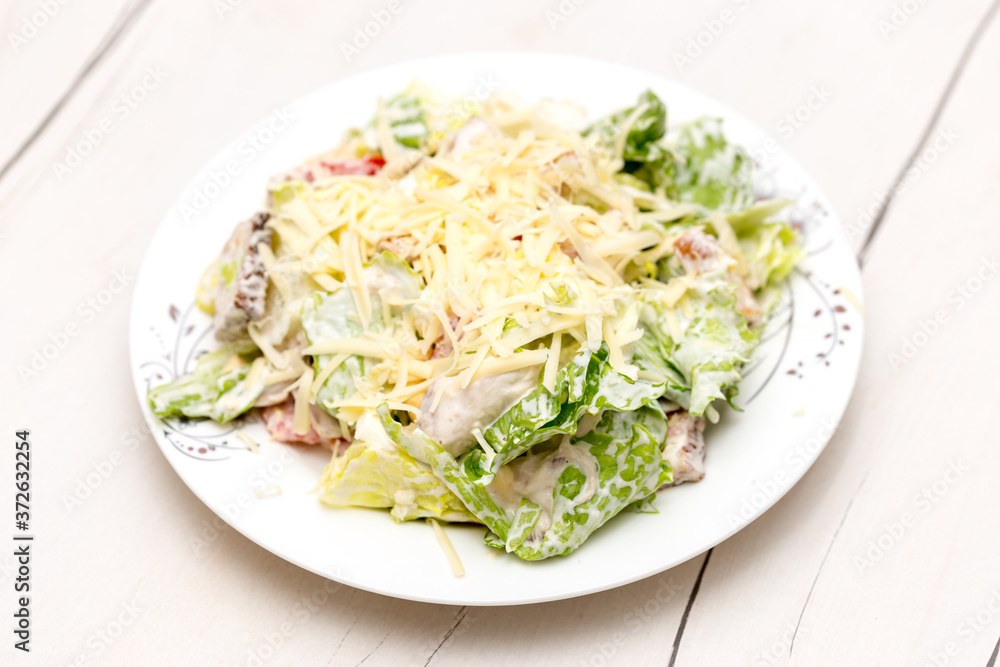 vegetable cabbage salad with mayonnaise and cheese, eggs on the table vegetable cabbage salad with mayonnaise and cheese, eggs on the table
