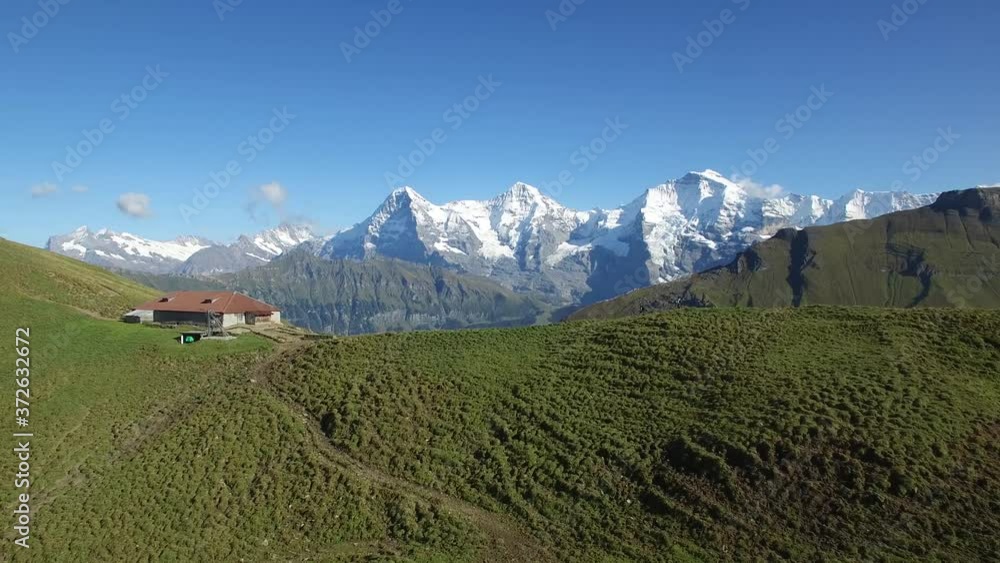 CINEMATIC FLY OVER OF HIKERS ON RIDGE IN INTERLAKEN SWITZERLAND CINEMATIC FLY OVER OF HIKERS ON RIDGE IN INTERLAKEN SWITZERLAND