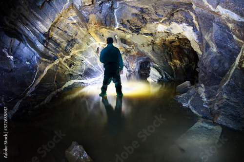Silhouette of a man in an abandoned mine