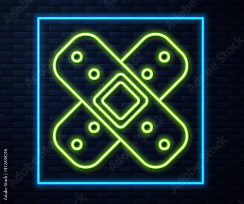 Glowing neon line Crossed bandage plaster icon isolated on brick wall background. Medical plaster, adhesive bandage, flexible fabric bandage. Vector Illustration.
