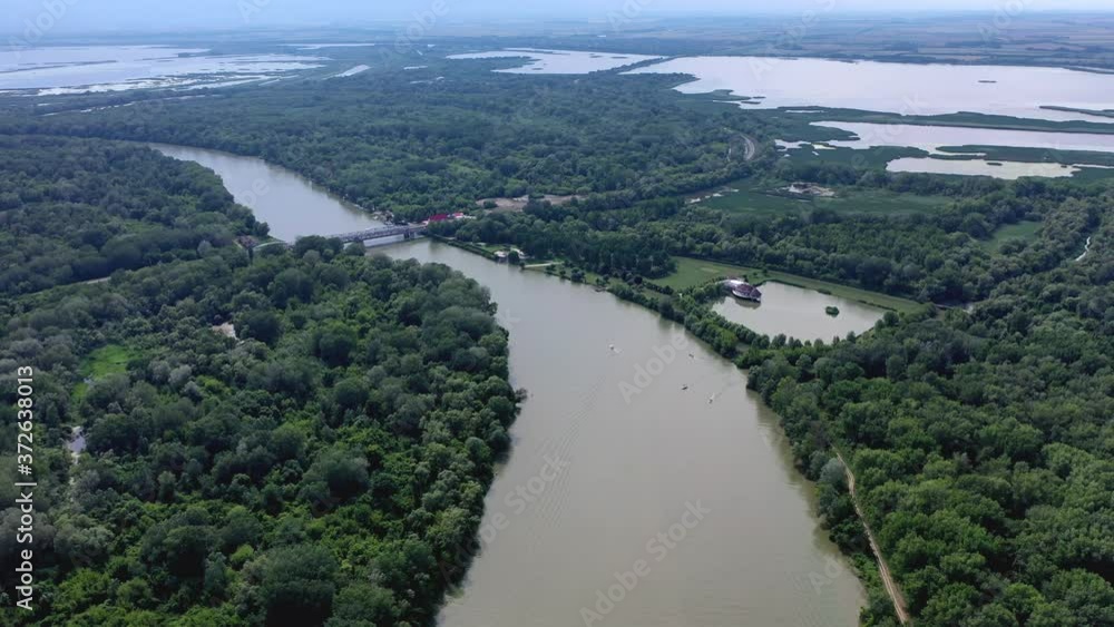 Parallax shot of the Hungarian Tisza river with a bridge crossing over. Parallax shot of the Hungarian Tisza river with a bridge crossing over.