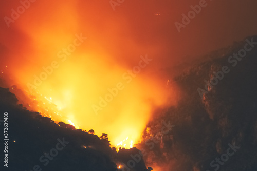 Close up look of a fire at a forest in Loutraki in Greece. 