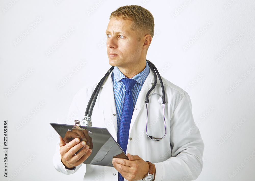 Young confident doctor in a white coat with a stethoscope Young confident doctor in a white coat with a stethoscope