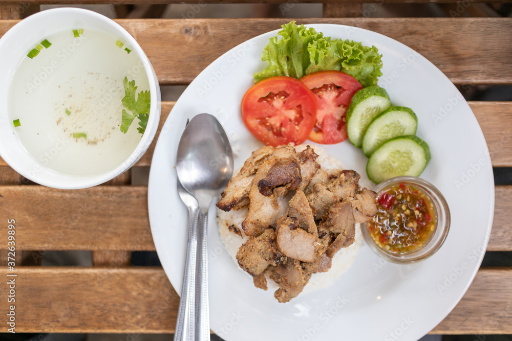 Top view of Thai white rice with streamed porks on white dish. Top view of Thai white rice with streamed porks on white dish.