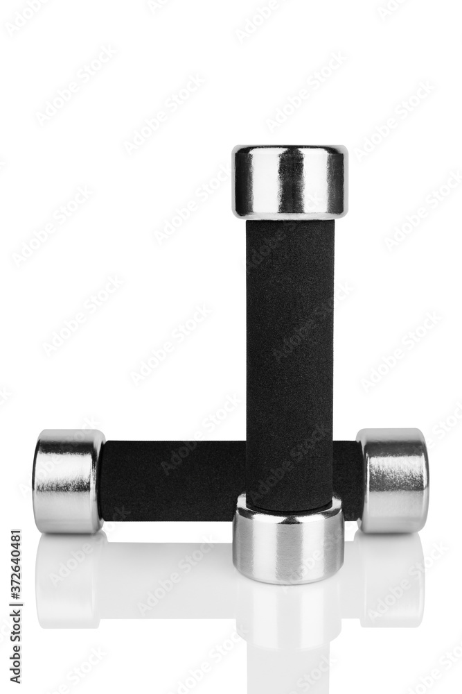 Two dumbbells on white background isolated close up with reflection, metal barbells set, pair of iron fitness bar-bells, sport equipment, bodybuilding concept, healthy lifestyle, gym training, nobody
