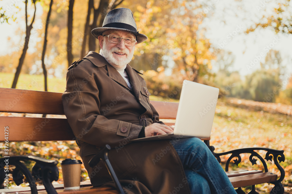 Photo of old man pensioner enjoy fall town park forest relax use laptop wifi modern connection type brows email sit bench wear cap headwear outerwear Photo of old man pensioner enjoy fall town park forest relax use laptop wifi modern connection type brows email sit bench wear cap headwear outerwear