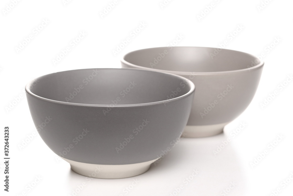 Empty round porcelain bowls isolated on white background Empty round porcelain bowls isolated on white background