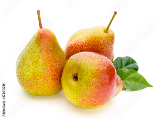 Fresh bio pear with leaves on isolated white background.