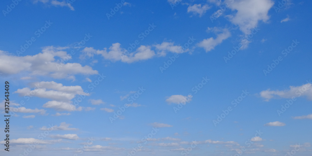 Blue spring sky with white clouds. Beautiful background. Blue spring sky with white clouds. Beautiful background.