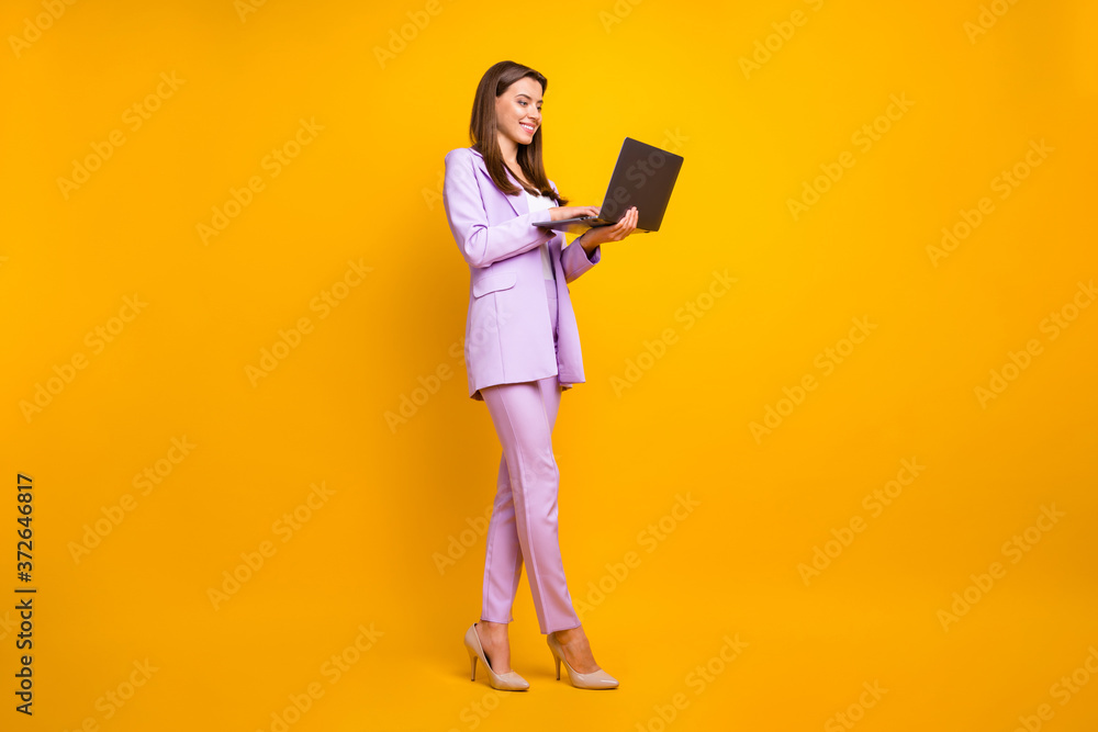 Full size profile photo of beautiful business ceo lady holding notebook hands chatting with colleagues partners wear stylish purple office costume isolated yellow color background Full size profile photo of beautiful business ceo lady holding notebook hands chatting with colleagues partners wear stylish purple office costume isolated yellow color background