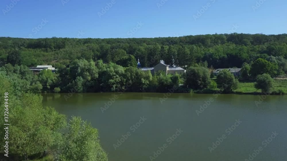 Aerial view of christian monastery. The lake and a view of the Thiganeshty Monastery. Moldova. Aerial view of christian monastery. The lake and a view of the Thiganeshty Monastery. Moldova.
