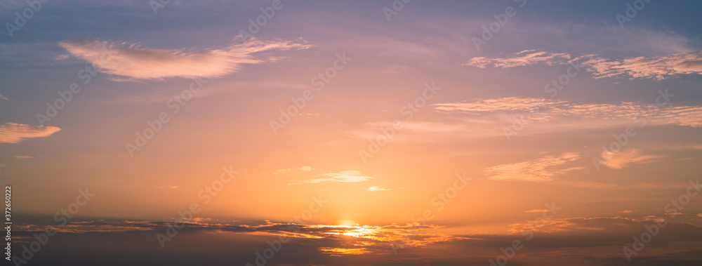 Landscape sunset in the sky for background,Panoramic banner cover design,Sky, Bright Blue, Orange And Yellow Colors Sunset.