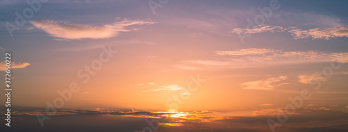 Landscape sunset in the sky for background,Panoramic banner cover design,Sky, Bright Blue, Orange And Yellow Colors Sunset.