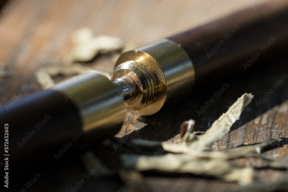 Naklejka premium Tea knife close-up on a wooden table.