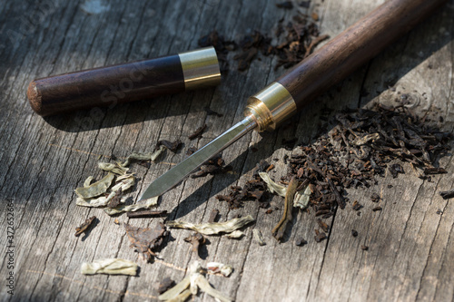 Tea knife close-up on a wooden table.