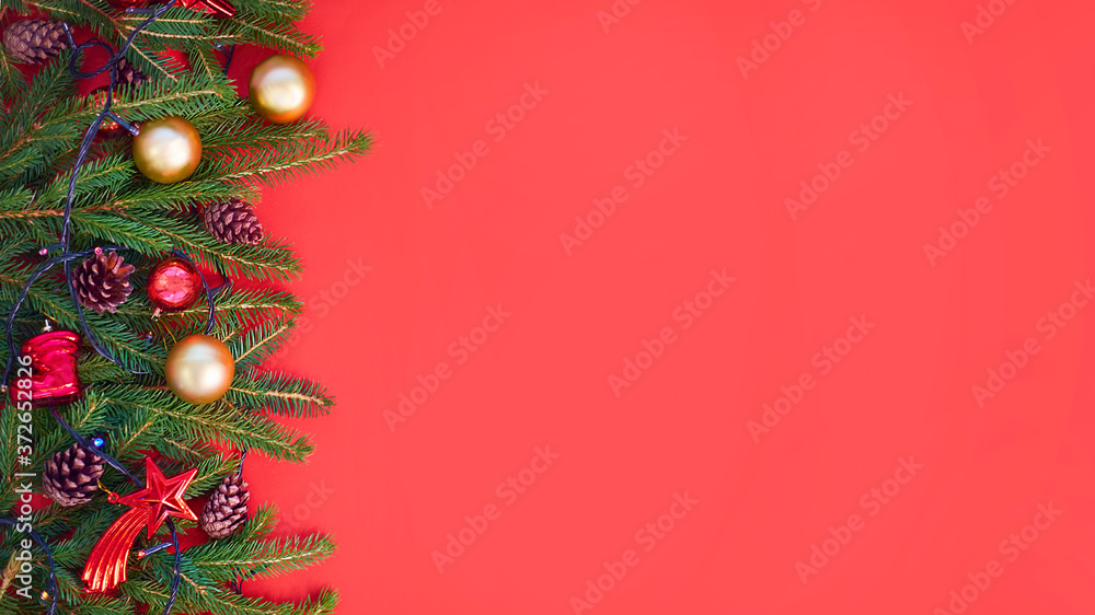 Christmas background with xmas tree on red canvas background. Merry christmas card. Winter holiday theme. Happy New Year. Space for text. christmas backdrop top view. Flat lay. Christmas background with xmas tree on red canvas background. Merry christmas card. Winter holiday theme. Happy New Year. Space for text. christmas backdrop top view. Flat lay.