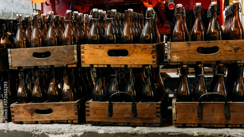 Old beer bottles in wooden boxes