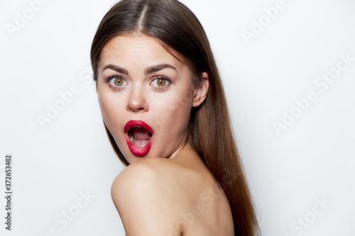 Charming woman Bare shoulders with open mouth red lips clear skin care