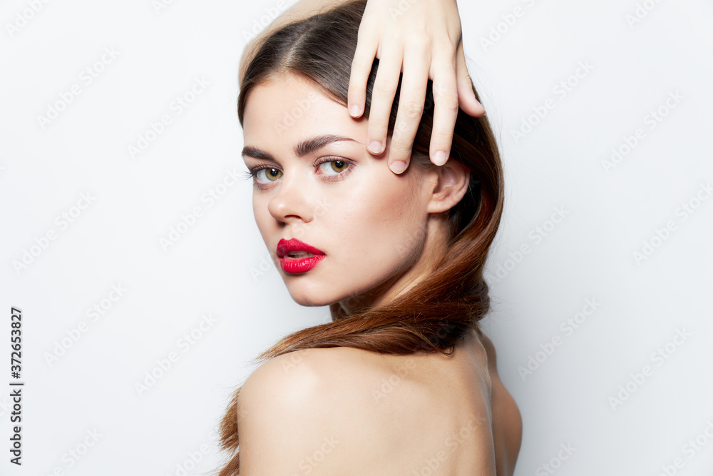 Charming woman Clean skin hand on head red lips charm natural look Charming woman Clean skin hand on head red lips charm natural look