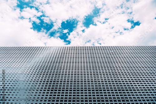 Dortmund, Germany - JUNE 2019: Abstract facade building of Deutch Fussbal Museum. German Soccer Museum on blue sky background photo