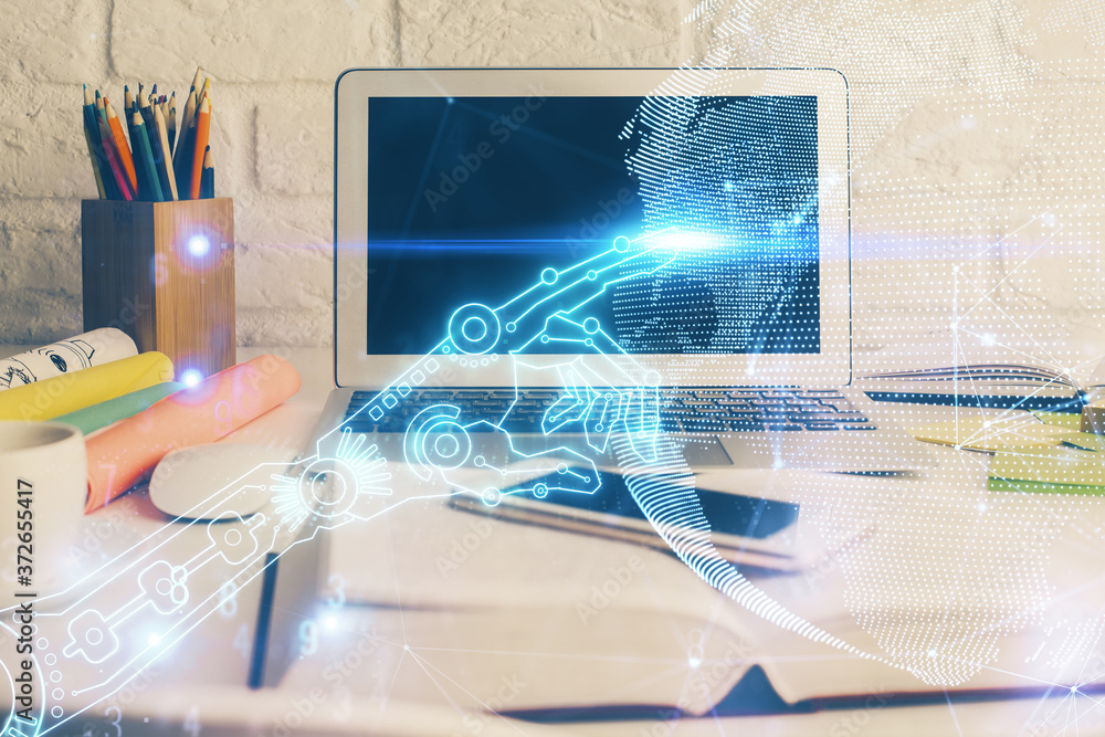 Computer on desktop in office with technology theme hologram. Double exposure. Tech concept. Computer on desktop in office with technology theme hologram. Double exposure. Tech concept.