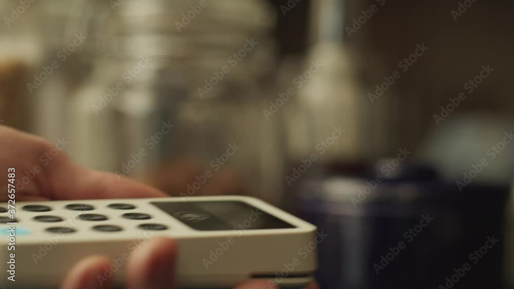 Contactless payment with a smart phone close up in an independent cafe Contactless payment with a smart phone close up in an independent cafe