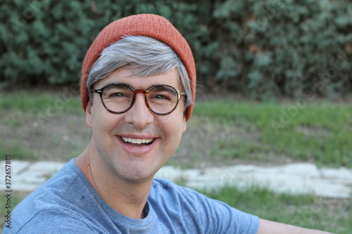 Middle aged man wearing eyeglasses and knit hat 