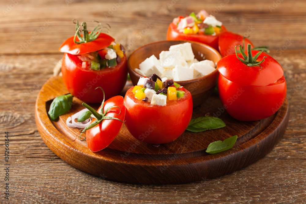 Greek stuffed tomato with feta cheese, olives, and fresh pepper. Greek stuffed tomato with feta cheese, olives, and fresh pepper.