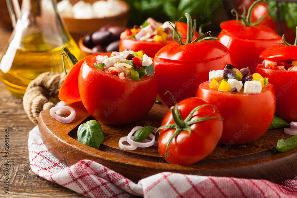 Greek stuffed tomato with feta cheese, olives, and fresh pepper. Greek stuffed tomato with feta cheese, olives, and fresh pepper.