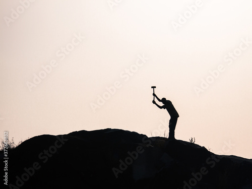 Man breaking rocks with hammer in Africa