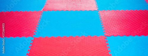 Photo background of blue and red tatami sport for martial arts.