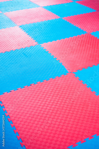 Photo background of blue and red tatami sport for martial arts.