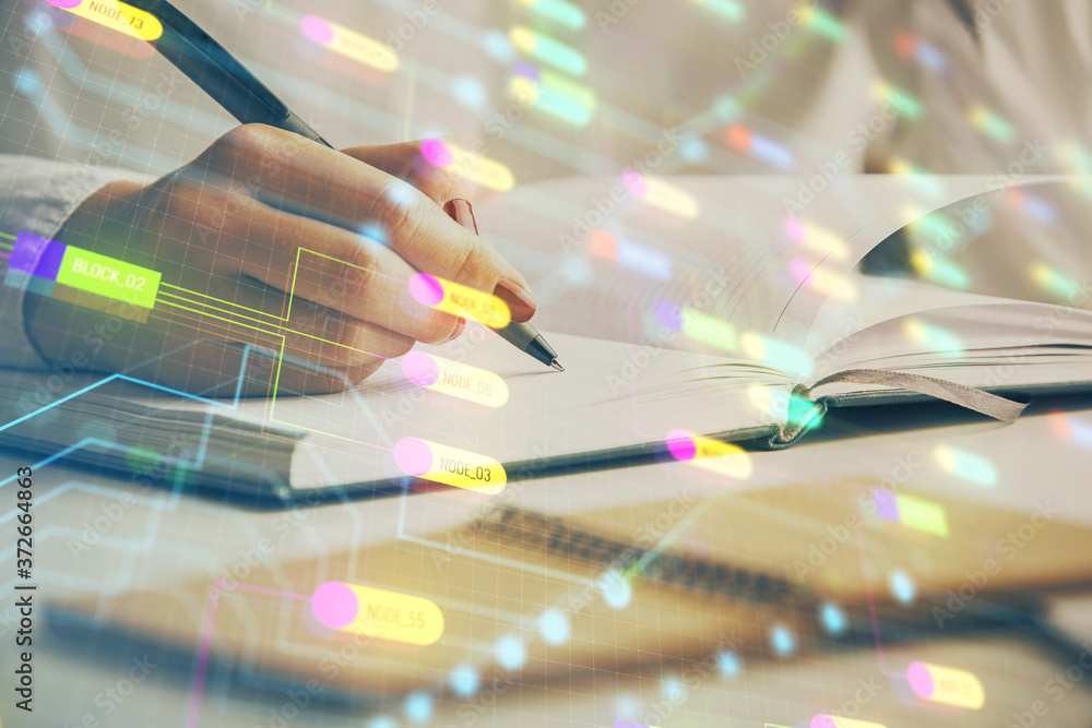 Multi exposure of writing hand on background with data technology hologram. Concept of innovation. Multi exposure of writing hand on background with data technology hologram. Concept of innovation.