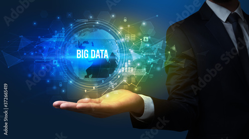 Wallpaper Mural Elegant hand holding BIG DATA inscription, digital technology concept Torontodigital.ca