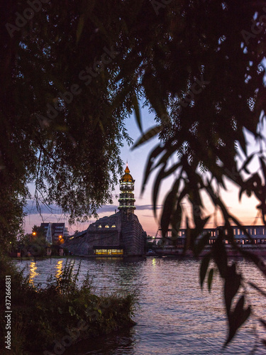 Evening view of the lighthouse and the water. Sunset mode.
