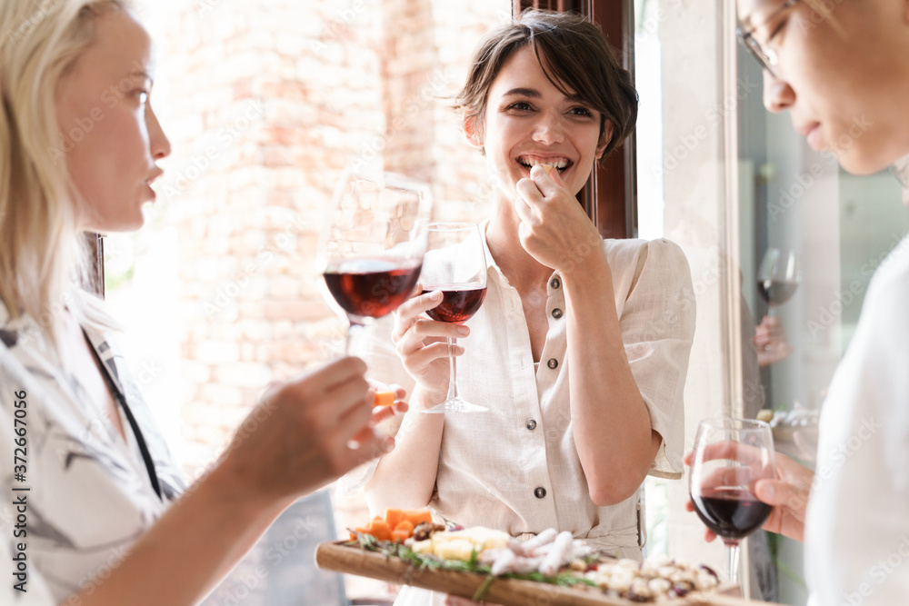 Friends enjoying glass of wine a