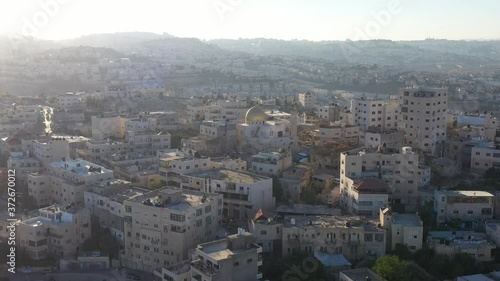Golden Dome Mosue in Anata refugees Camp, Palestine,Israel, Aerial
Drone view, August, 2020, Sunset
 photo