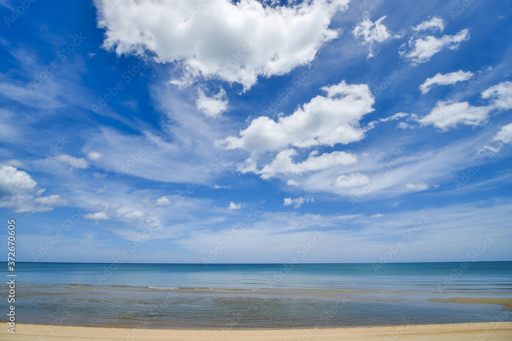 seascape white sand beach with clear wave water and blue sky with white clouds at sountern sea of Thailand