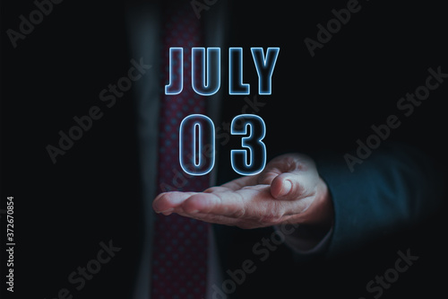 Wallpaper Mural july 3rd. Day 3 of month, announcement of date of  business meeting or event. businessman holds the name of the month and day on his hand.. summer month, day of the year concept Torontodigital.ca