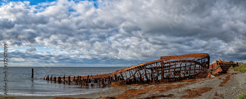Remains of the old ship at San Gregorio in Magellanes, southern Chile. photo