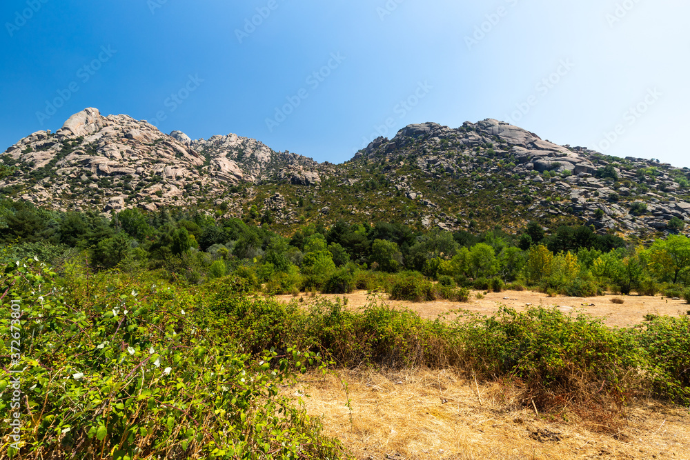 La Pedriza National Park on the southern slopes of the Guadarrama mountain range in Madrid, with cascades. It is one of the largest granitic ranges. It has amazing nature and plenty of leisure options