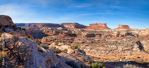 Panoramic photo of the Iconic buttes Monitor and Merrimac at the Canyonlands National Park in Utah. 