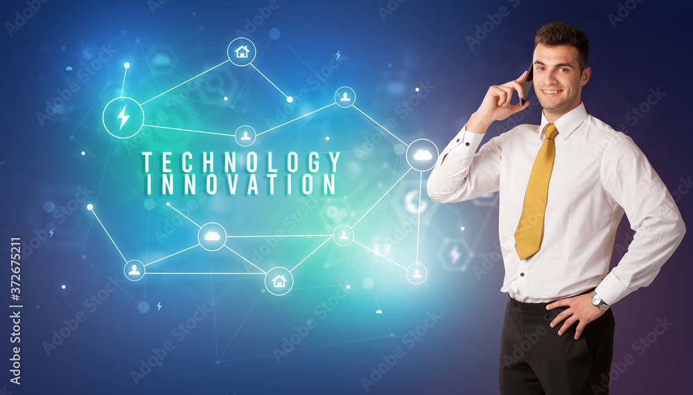 Businessman in front of cloud service icons with TECHNOLOGY INNOVATION inscription, modern technology concept Businessman in front of cloud service icons with TECHNOLOGY INNOVATION inscription, modern technology concept