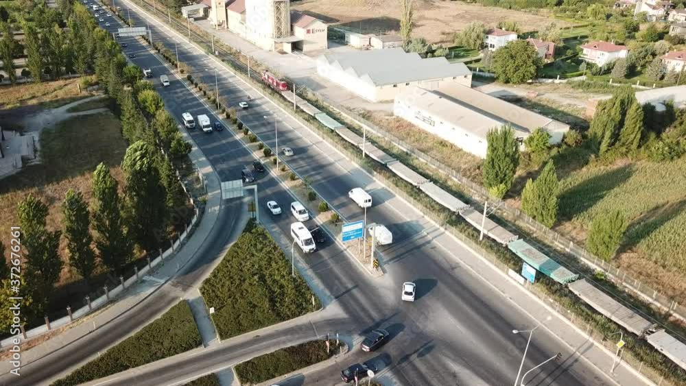 Aerial view of two lane bridge driveway. There is an inner ring road at the bottom. Vehicles and commercial vehicles can also be seen. Aerial view of two lane bridge driveway. There is an inner ring road at the bottom. Vehicles and commercial vehicles can also be seen.