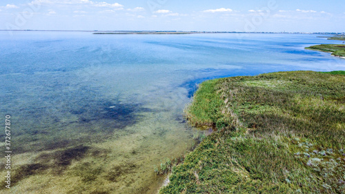 Top view of a beautiful lake with blue transparent water