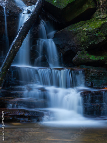 Water flowing through rock cascade.